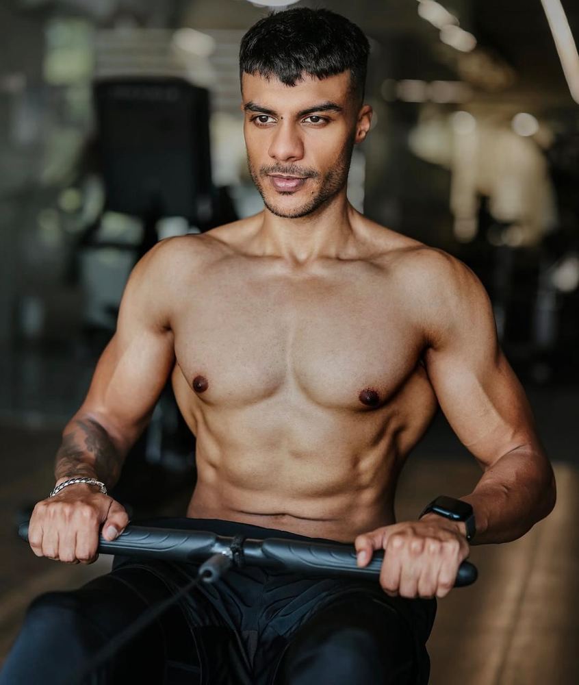 Sanchit training on a rowing machine